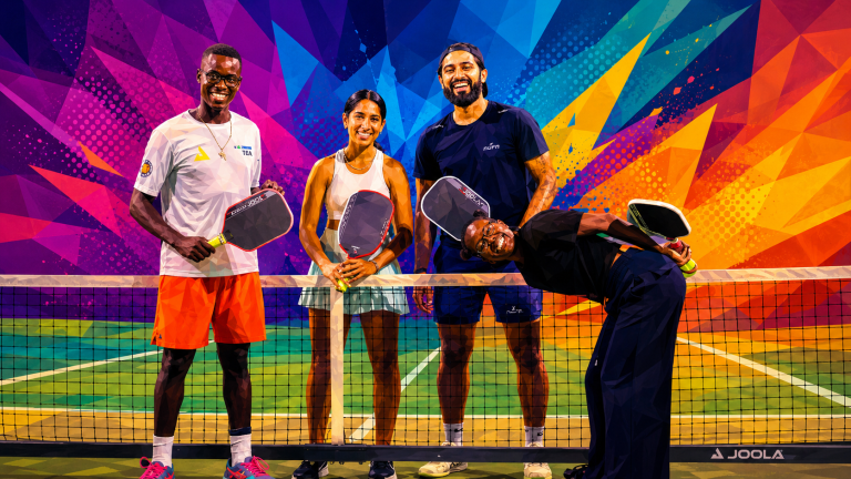 A diverse group of players posing at the Tanzania Open pickleball tournament in East Africa.